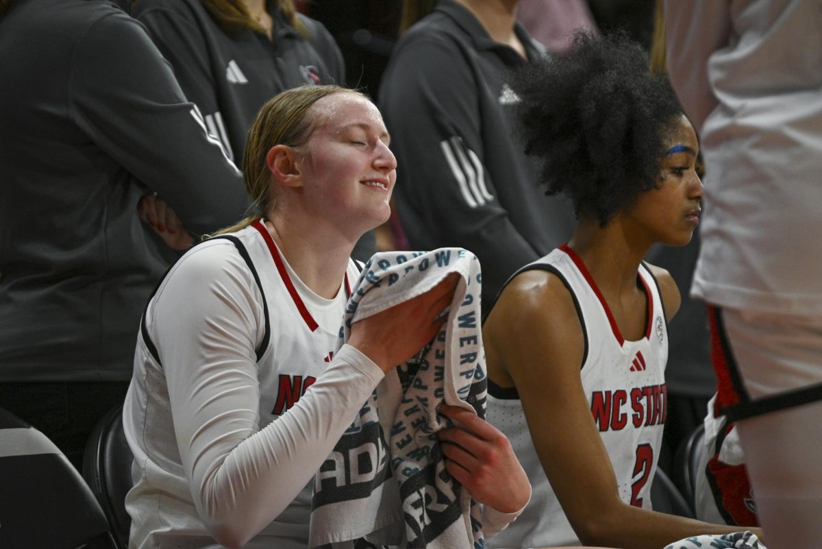 Junior forward Maddie Cox rests on the bench during the game against Stanford at Reynolds Coliseum on Thursday, Jan. 1, 2026. Cox scored a total of seven points. The Wolfpack defeated the Cardinals 74-46.