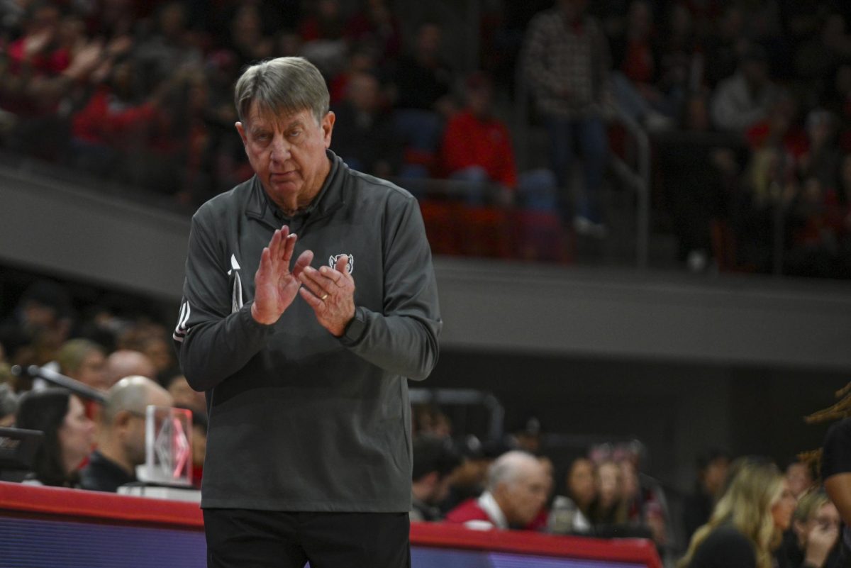Head coach Wes Moore claps from the sideline during the game against Stanford at Reynolds Coliseum on Thursday, Jan. 1, 2026. The Wolfpack defeated the Cardinals 74-46.