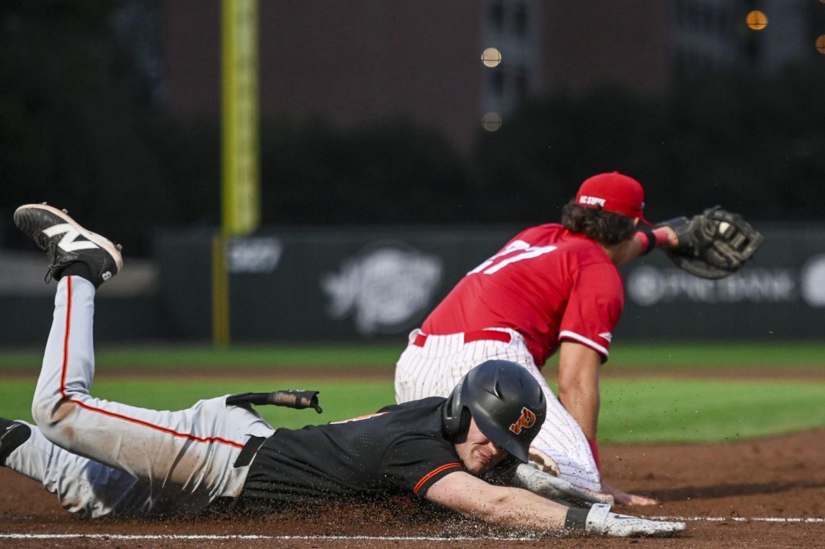 Junior infielder Chris McHugh catches the ball during a play during the game against Princeton in Doak Field at Dail Park on Saturday, Feb. 21, 2026. The Tigers defeated the Wolfpack 1-0.