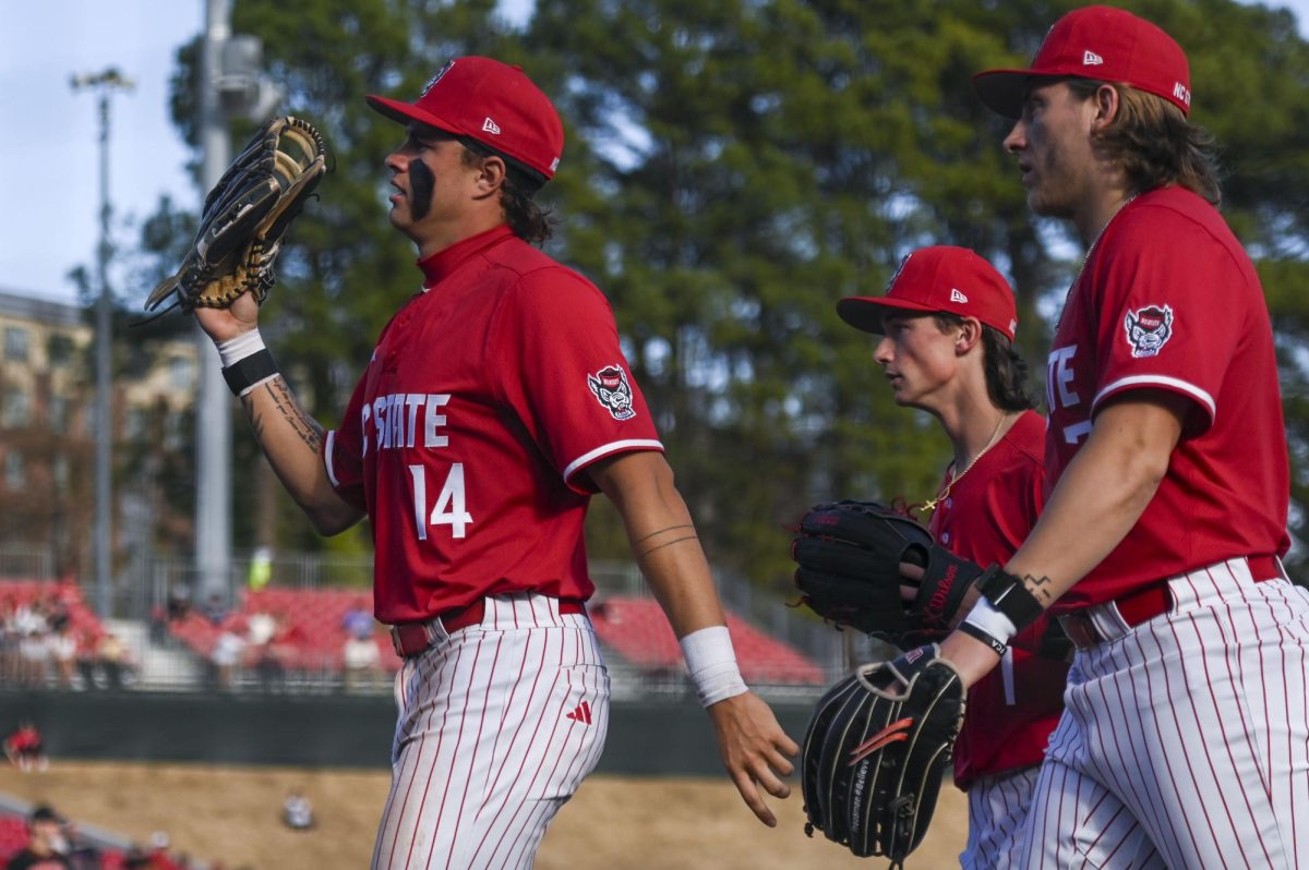 Sophomore outfielder Ty Head, freshman outfielder Rett Johnson and senior outfielder Brayden Fraasman come in from the outfield between innings during the game against Princeton in Doak Field at Dail Park on Saturday, Feb. 21, 2026. The Tigers defeated the Wolfpack 1-0.