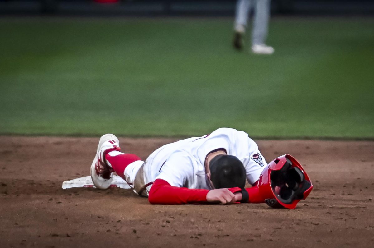 Senior infielder Dalton Bargo puts his head down after sliding into second during the game against Richmond at Doak Field in Dail Park on Tuesday, Feb. 24, 2026. Bargo would not return. The Wolfpack defeated the Spiders 27-0.