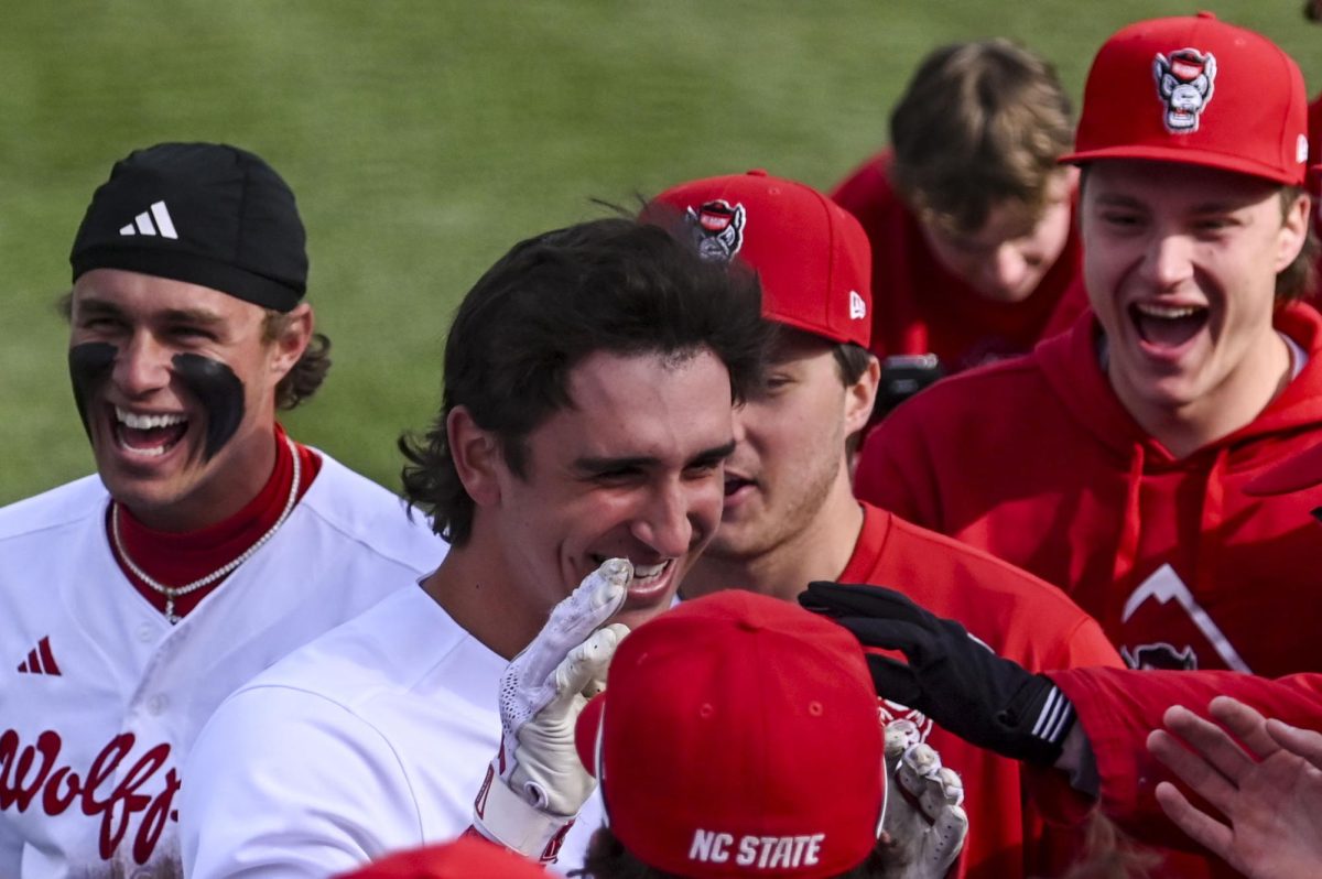 Junior infielder Chris McHugh celebrates his home run with his teammates during the game against Richmond at Doak Field in Dail Park on Tuesday, Feb. 24, 2026. McHugh recorded three RBIs. The Wolfpack defeated the Spiders 27-0.