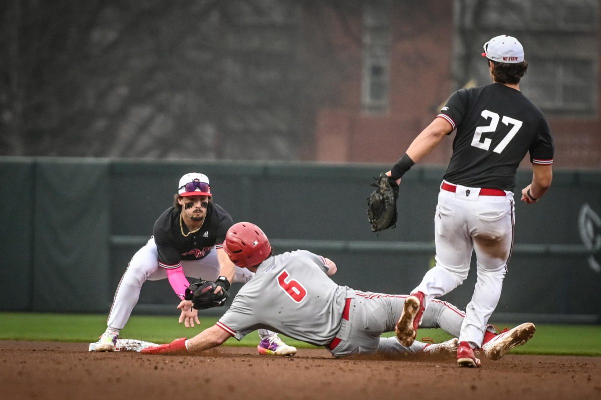 NC State junior outfielder Andrew Wiggins dives for home base during the game against Sacred Heart in Doak Field at Dail Park on Friday, Feb. 27, 2026. The Wolfpack defeated the Pioneers 17-4.