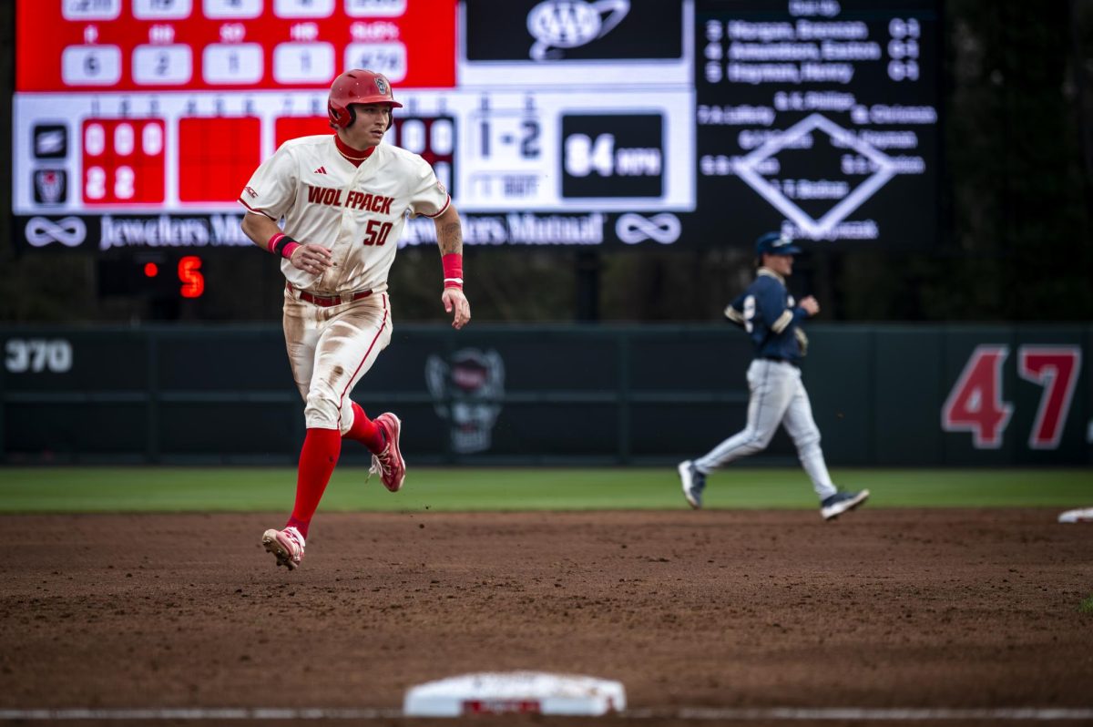 NC State sophomore infielder Brandon Novy strides into third base during the game against Akron in Doak Field at Dail Park on Friday, Feb. 20, 2026. The Wolfpack defeated the Zips 18-3.
