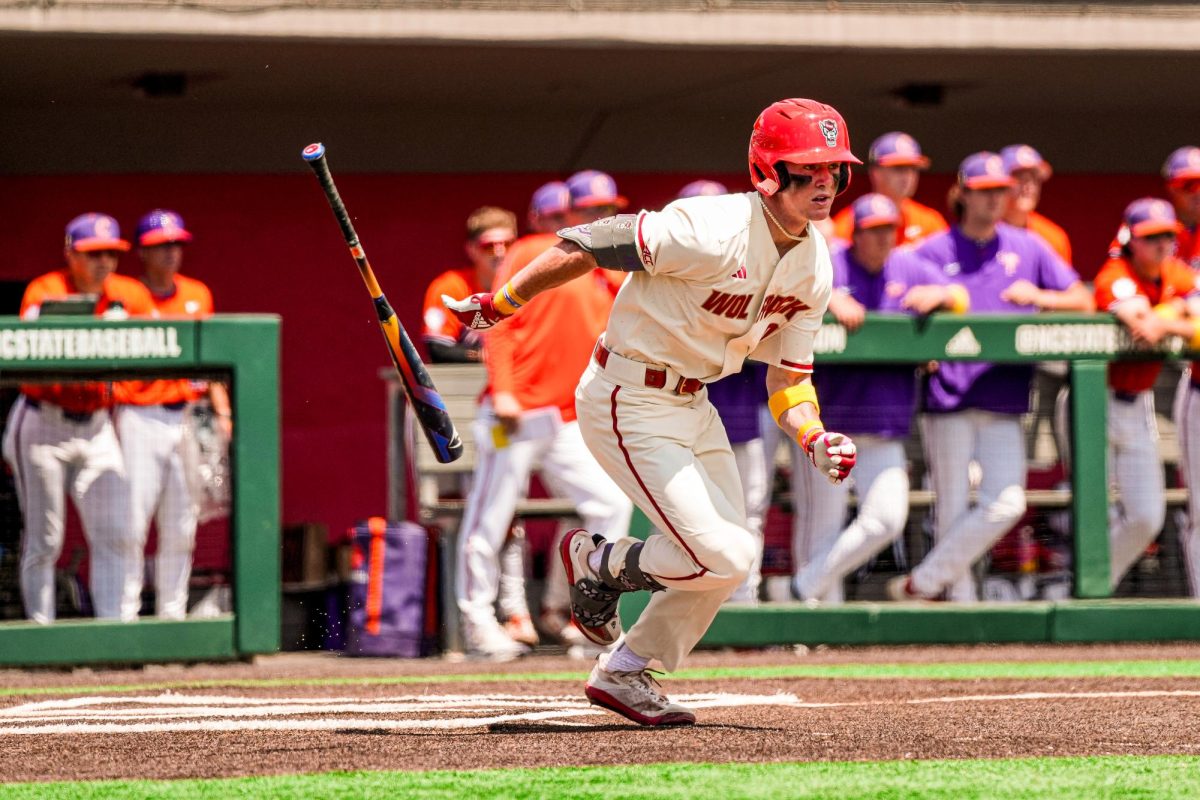 Sophomore infielder Luke Nixon drops the bat while sprinting to first base during the annual "Victory over Cancer" game at Doak Field at Dail Park on Sunday, April 27, 2025. NC State beat Clemson 4-1.