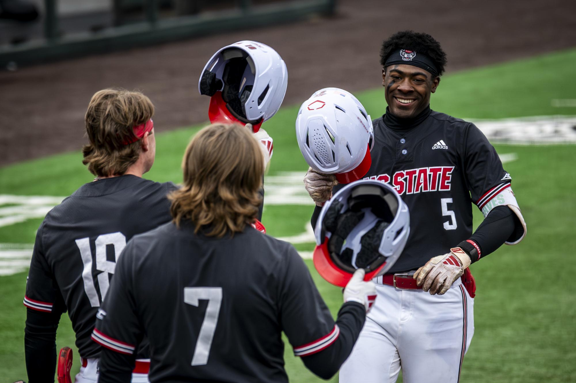 Junior infielder Sherman Johnson smiles after hitting a home run during the game against Sacred Heart in Doak Field at Dail Park on Friday, Feb. 27, 2026. The Wolfpack defeated the Pioneers 17-4 in seven innings.