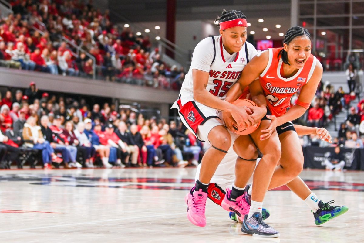 Junior guard Zoe Brooks fights for the ball during the game against Syracuse in Reynolds Coliseum on Sunday, Feb. 22, 2026. Brooks had 20 points, five rebounds and two steals. NC State beat Syracuse 82-69.