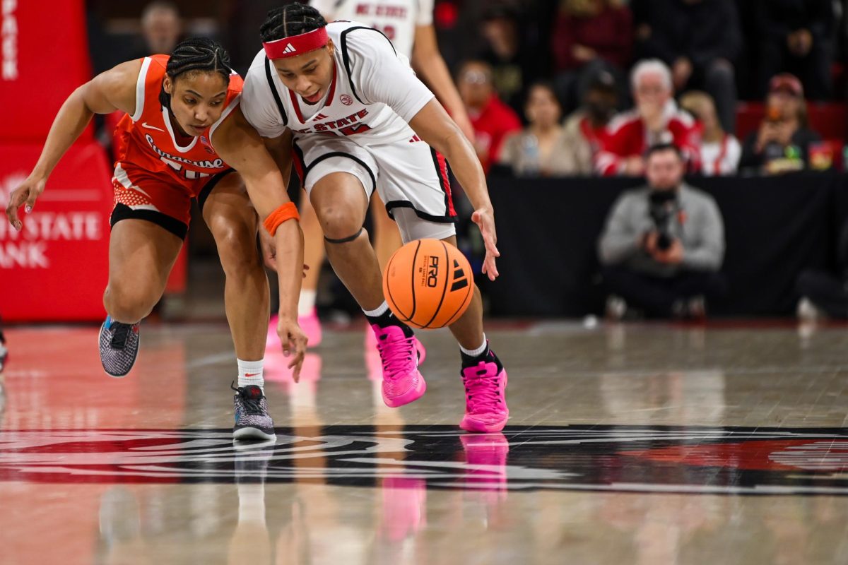 Junior guard Zoe Brooks fights for the ball during the game against Syracuse in Reynolds Coliseum on Sunday, Feb. 22, 2026. Brooks had 20 points, five rebounds and two steals. NC State beat Syracuse 82-69.