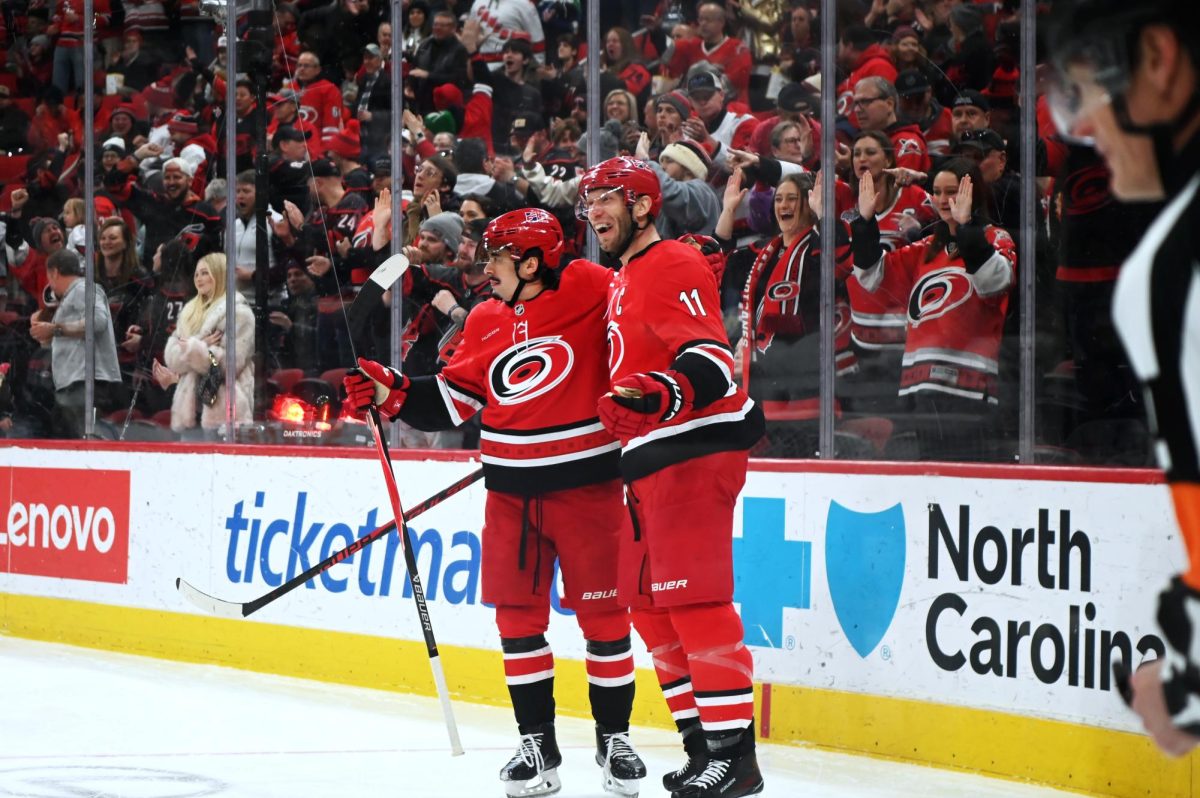 Centers Seth Jarvis and Jordan Staal celebrate after a goal scored by Staal during the game versus the Los Angeles Kings at the Lenovo Center on Sunday, Feb. 1, 2026. Staal scored one goal for the Hurricanes. The Hurricanes beat the Kings 3-2 in overtime.