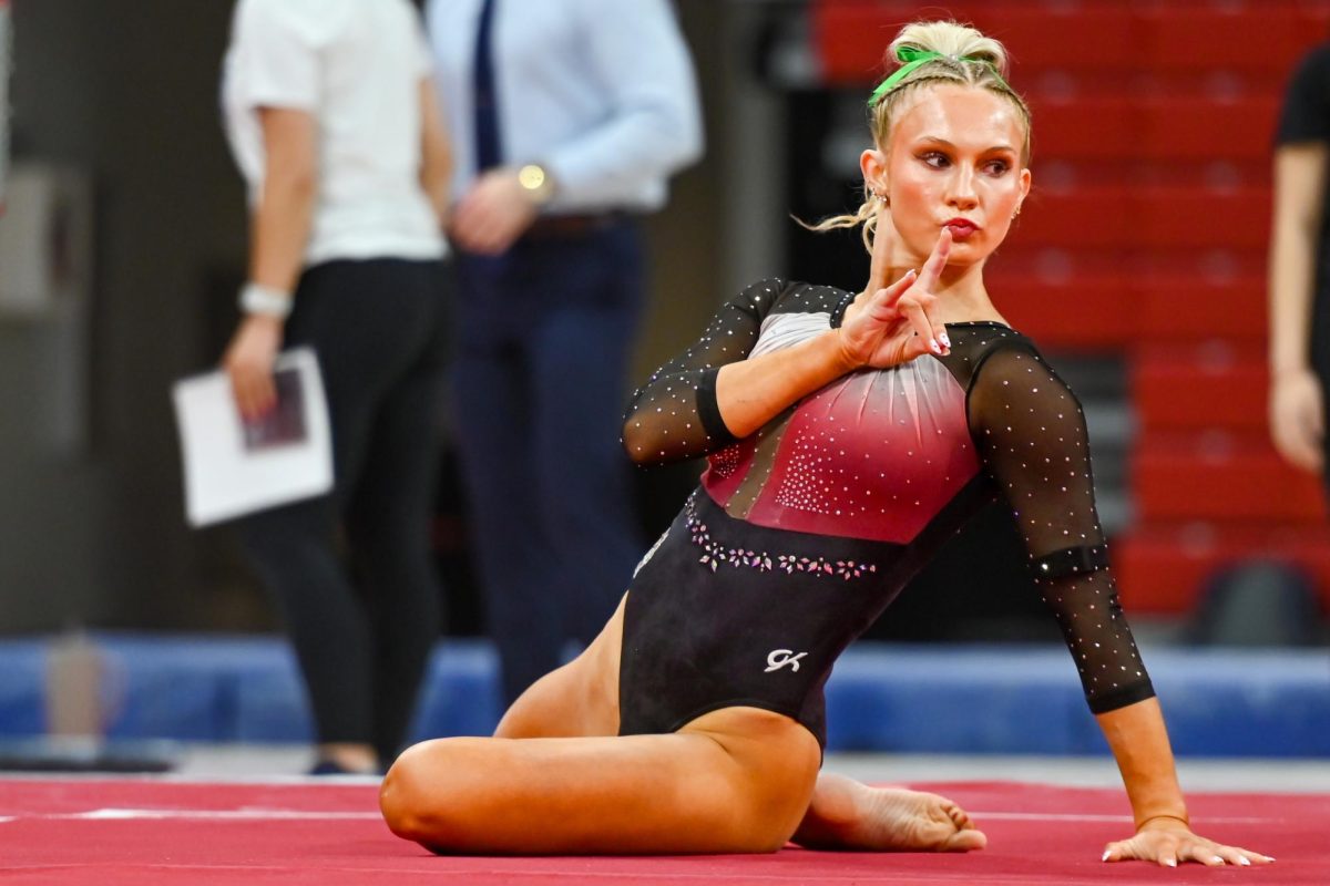 Junior Katie Harper poses at the end of the floor routine during the meet against Yale, New Hampshire, and George Washington University at Reynolds Coliseum on Friday, Feb. 27, 2026. The Wolfpack beat the Bulldogs, Wildcats, and the Revolutionaries with a score of 196.700.