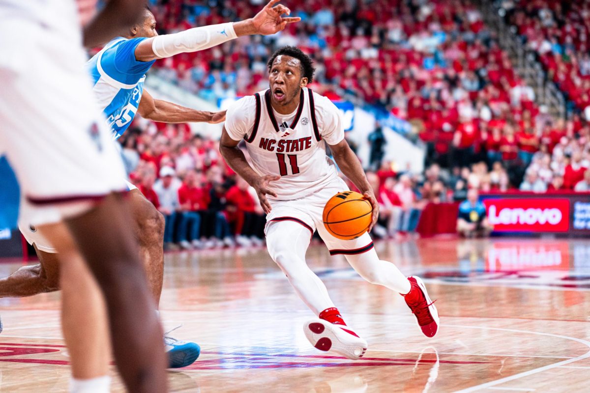 Senior guard Quadir Copeland drives to the basket evading the defense during the game against North Carolina at the Lenovo Center on Tuesday, Feb. 17, 2026. Copeland finished with 20 points, seven assists, and six rebounds. The Wolfpack defeated the Tar Heels 82-58.
