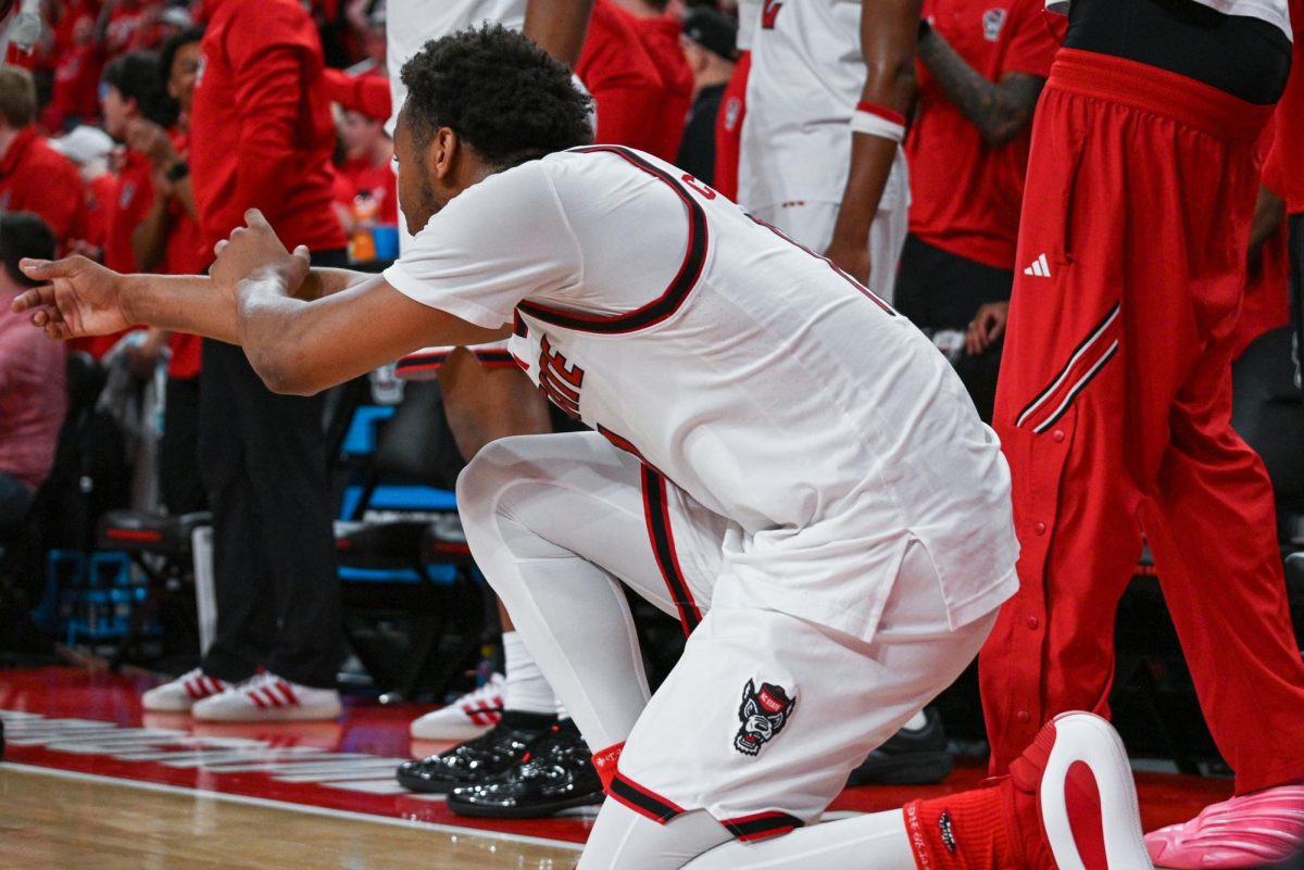 Senior guard Quadir Copeland celebrates a shot scored by freshman guard Matt Able during the game against North Carolina at the Lenovo Center on Tuesday, Feb. 17, 2026. Copeland finished with 20 points, seven assists, and six rebounds. The Wolfpack defeated the Tar Heels 82-58.
