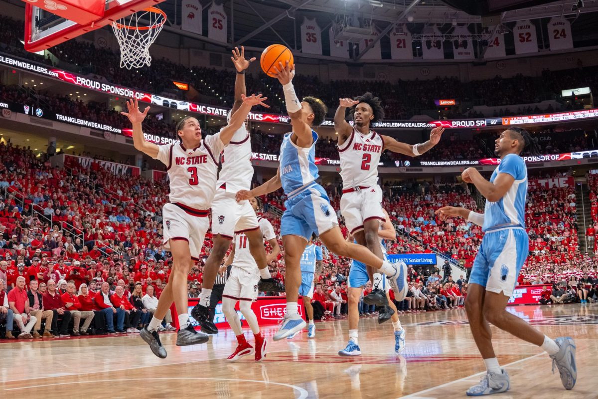 Multiple defenders jump for the ball during the game against North Carolina at the Lenovo Center on Tuesday, Feb. 17, 2026. The Wolfpack defeated the Tar Heels 82–58.