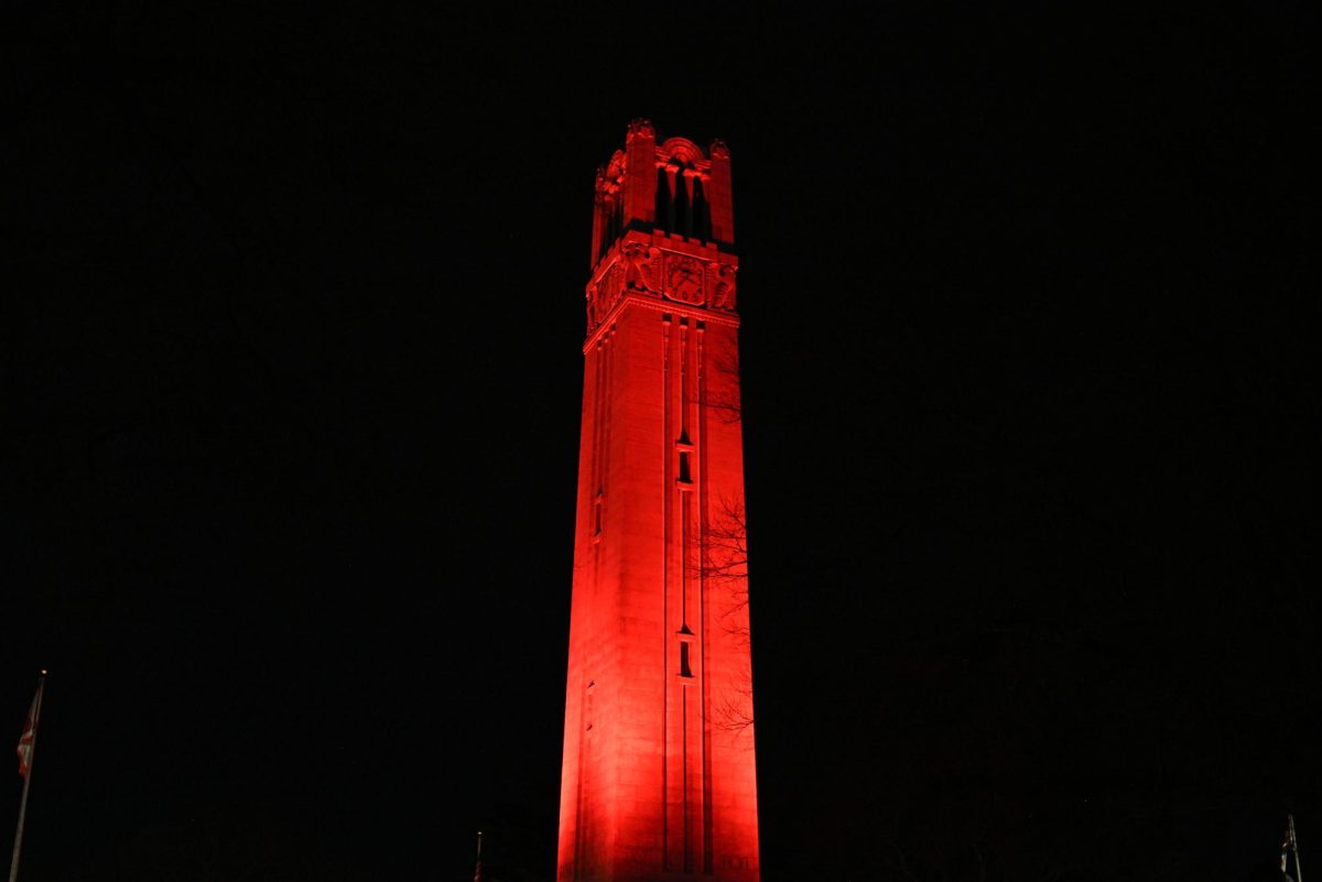 The bell tower lit red after the game against North Carolina at the Lenovo Center on Tuesday, Feb. 17, 2026. The Wolfpack defeated the Tar Heels 82-58.
