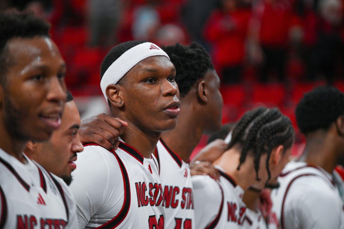 Senior forward Ven-Allen Lubin stands with his team after the game against North Carolina at the Lenovo Center on Tuesday, Feb. 17, 2026. Lubin finished with 12 points against his former team. The Wolfpack defeated the Tar Heels 82–58.