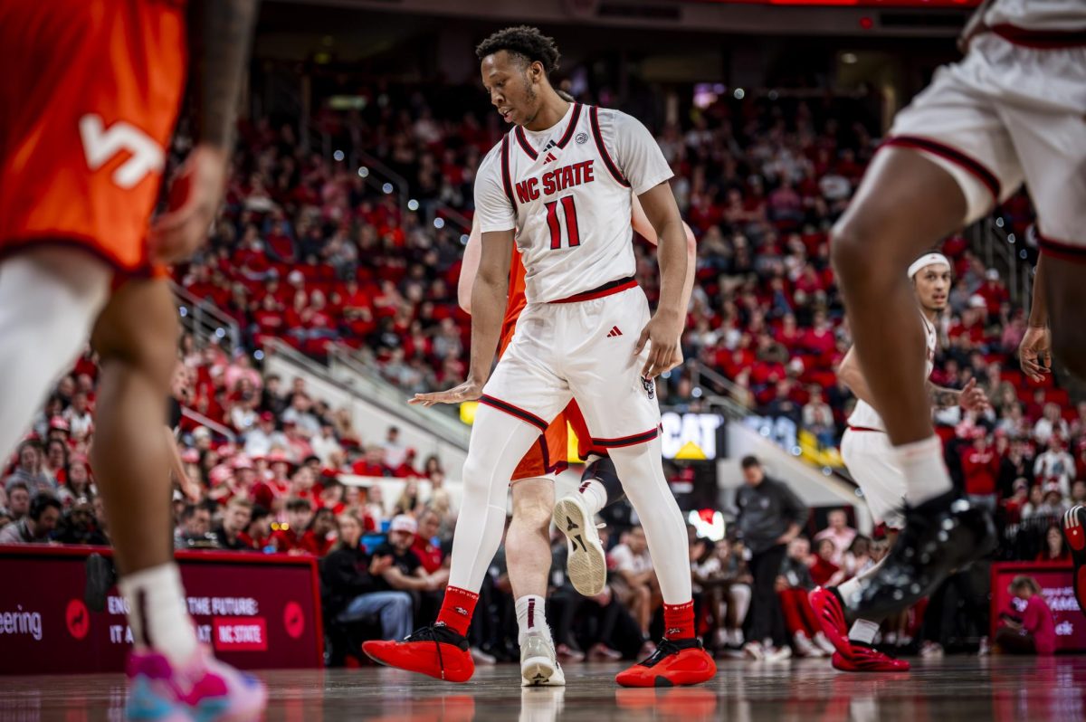 NC State senior guard Quadir Copeland does a "too small" celebration after scoring during the game against Virginia Tech in the Lenovo Center on Saturday, Feb. 7, 2026. Copeland had 21 points and 10 assists. The Wolfpack defeated the Hokies 82-73.
