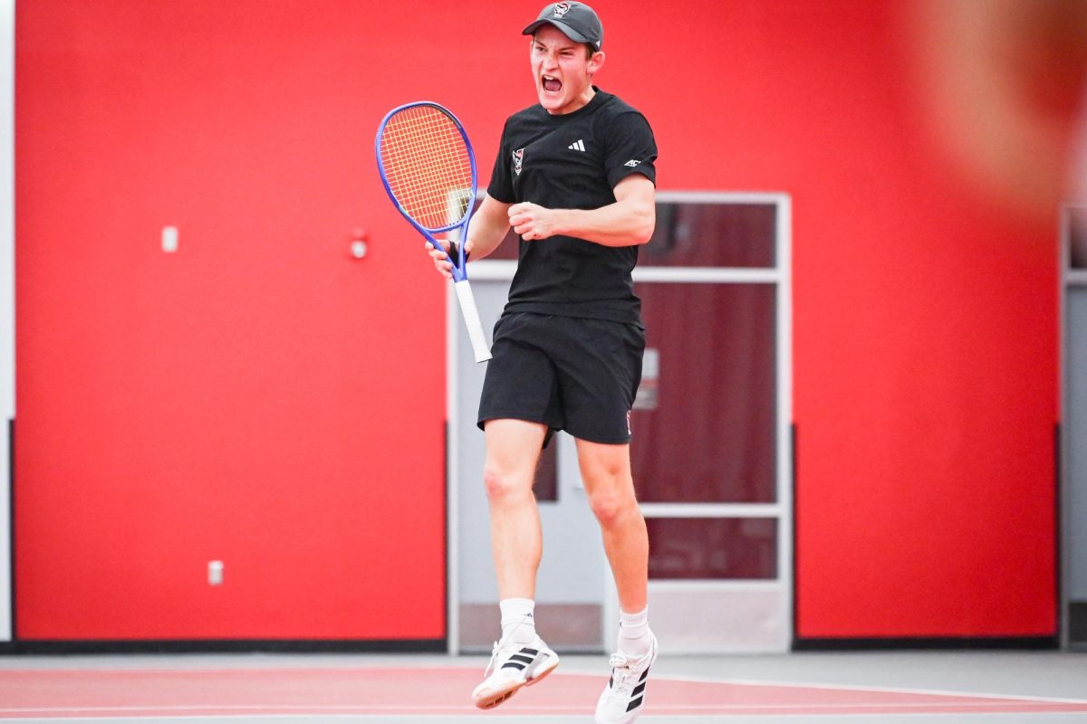 Freshman Charlie Camus celebrates during his singles match against Princeton University at the J.W. Isenhour Tennis Center on Friday, Feb. 6, 2026. Camus won his singles match 7-6 (8-6), 6-1, and won his doubles match 6-3 with partner redshirt sophomore William Manning. The Wolfpack beat the Tigers 4-3.