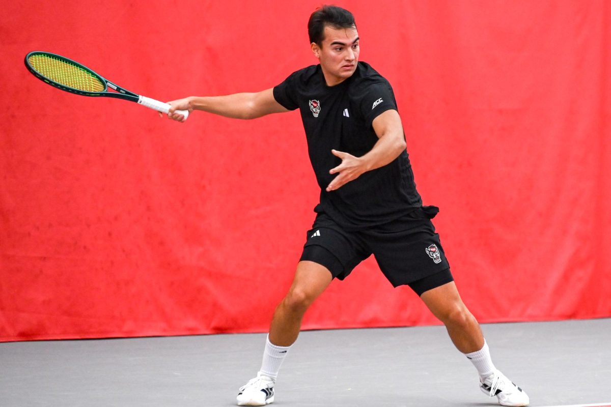 Freshman Darius Pop prepares to swing his racket during his singles match against Princeton University at the J.W. Isenhour Tennis Center on Friday, Feb. 6, 2026. Pop won his singles match 2-6, 7-6 (7-3), 6-0. The Wolfpack beat the Tigers 4-3.