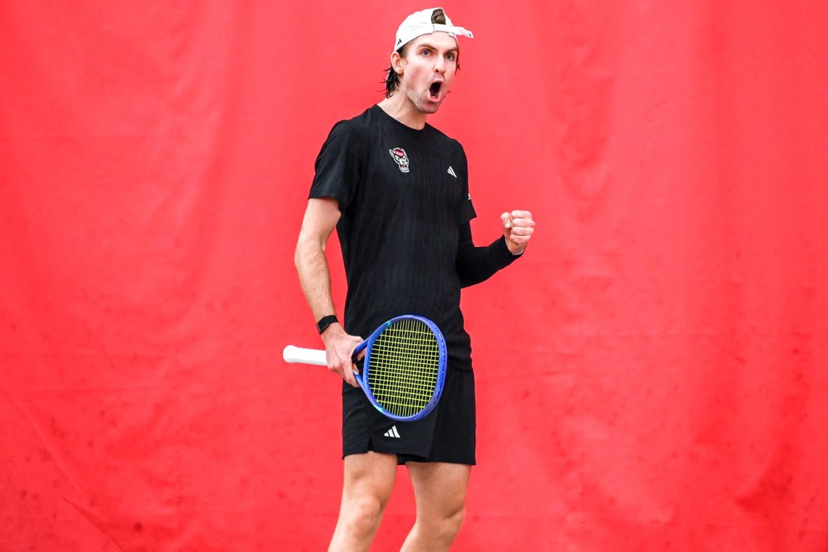 Freshman Ainius Sabaliauskas celebrates during his singles match against Princeton University at the J.W. Isenhour Tennis Center on Friday, Feb. 6, 2026. Sabaliauskas lost his singles match 7-6 (7-3), 6-4. The Wolfpack beat the Tigers 4-3.