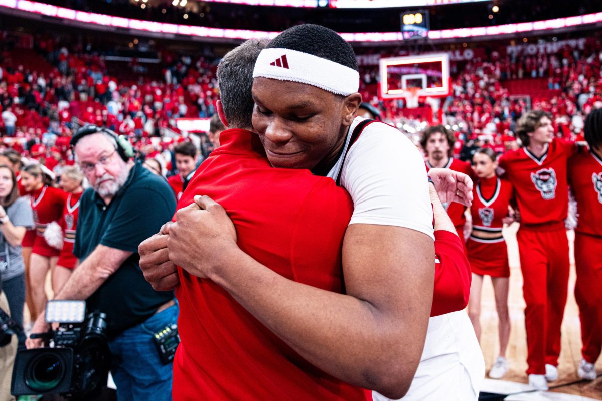 Senior forward Ven-Allen Lubin hugs Head Coach Will Wade after the game against North Carolina at the Lenovo Center on Tuesday, Feb. 17, 2026. Lubin finished with 12 points against his former team. The Wolfpack defeated the Tar Heels 82–58.