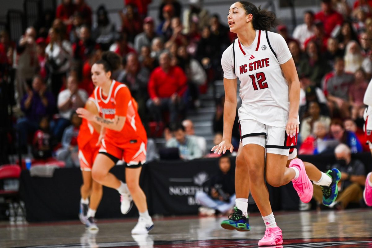 Junior forward Khamil Pierre does the "too little" celebration during the game against Syracuse in Reynolds Coliseum on Sunday, Feb. 22, 2026. Pierre had 25 points, 15 rebounds, and two steals. NC State beat Syracuse 82-69.