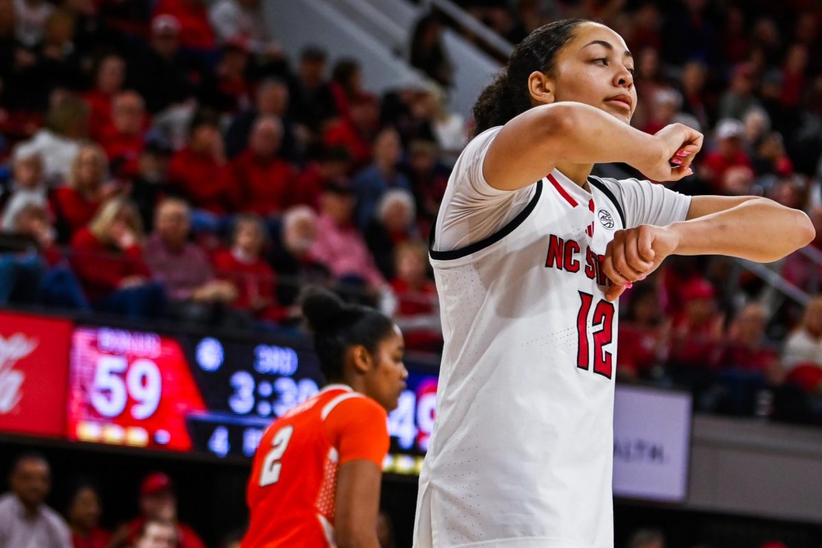 Junior forward Khamil Pierre does the travel motion during the game against Syracuse in Reynolds Coliseum on Sunday, Feb. 22, 2026. Pierre had two assists and two steals. NC State beat Syracuse 82-69.