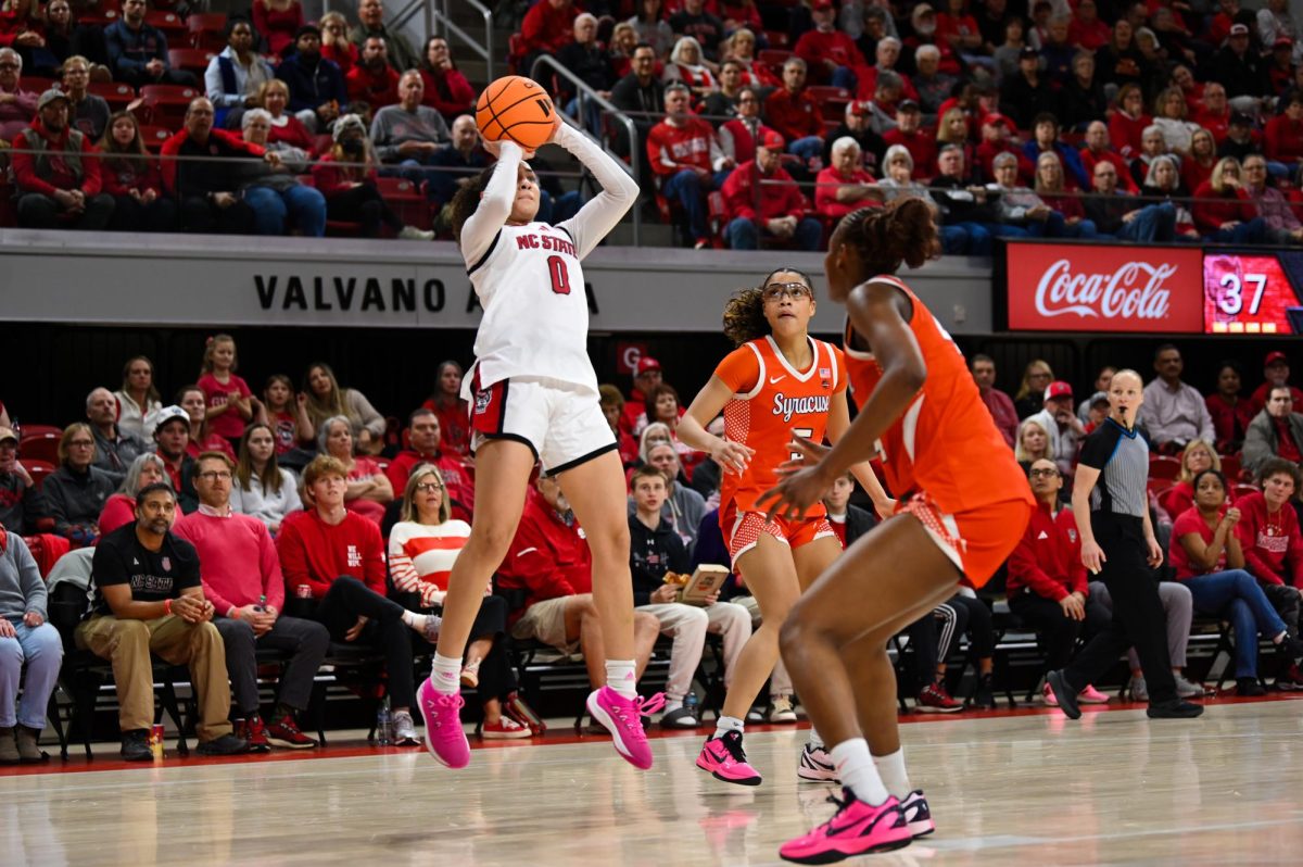 Sophomore guard Devyn Quigley shoots the ball during the game against Syracuse in Reynolds Coliseum on Sunday, Feb. 22, 2026. Quigley had four points and three rebounds. NC State beat Syracuse 82-69.