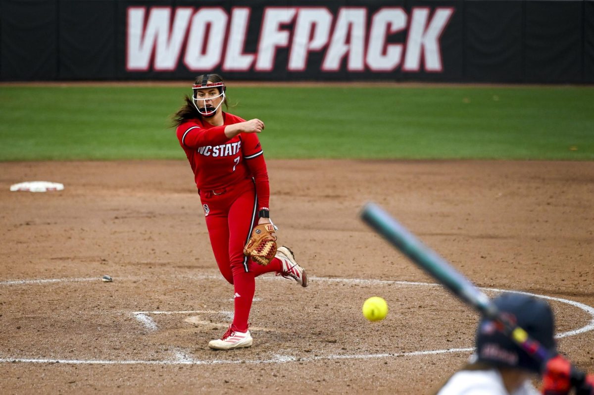 Redshirt-junior pitcher Wynne Gore fires a pitch during the game against Illinois in Dail Softball Stadium on Sunday, Feb. 22, 2026. The Wolfpack defeated the Illini 4-0. 