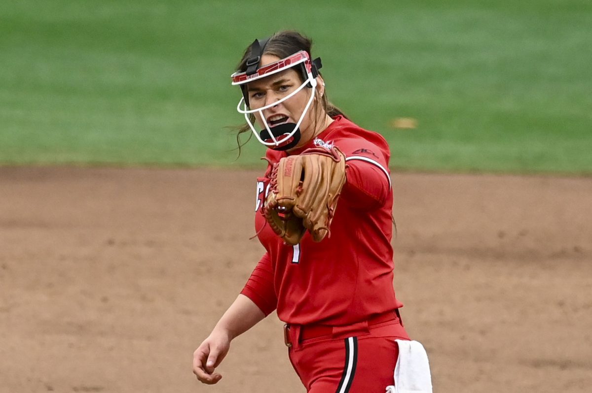 Redshirt-junior pitcher Wynne Gore shouts after a strikeout during the game against Illinois in Dail Softball Stadium on Sunday, Feb. 22, 2026. The Wolfpack defeated the Illini 4-0.