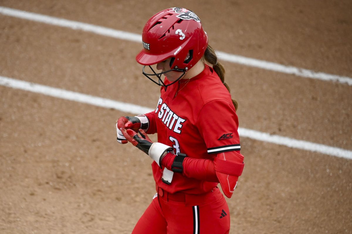 Freshman first baseman Morgen Talley walks back to the dugout during the game against Illinois in Dail Softball Stadium on Sunday, Feb. 22, 2026. Talley had one RBI. The Wolfpack defeated the Illini 4-0. 