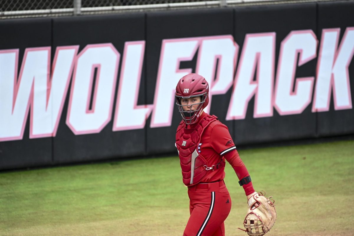 Senior catcher Ellington Whitaker prepares before the top of the inning during the game against Illinois in Dail Softball Stadium on Sunday, Feb. 22, 2026. The Wolfpack defeated the Illini 4-0. 