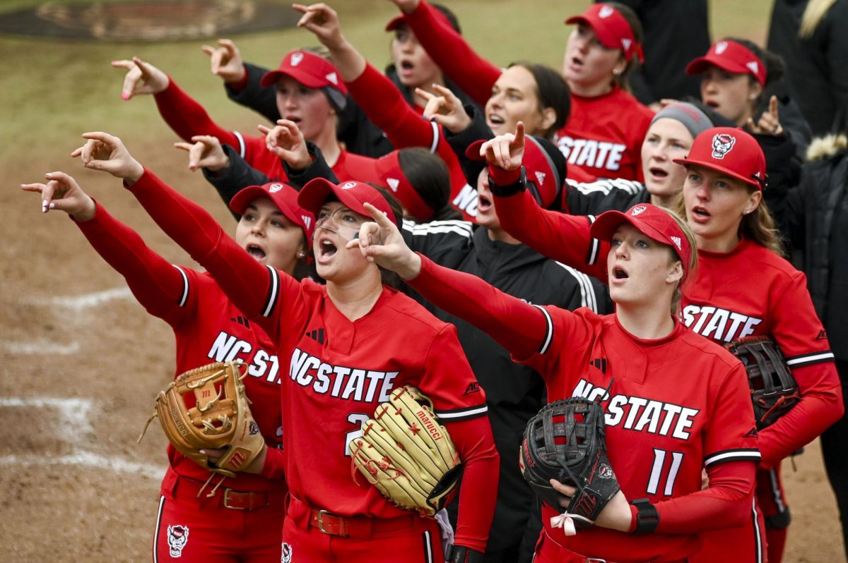 NC State's Softball team throws up "wolfies" to the crowd after their win against Illinois in Dail Softball Stadium on Sunday, Feb. 22, 2026. The Wolfpack defeated the Illini 4-0. 