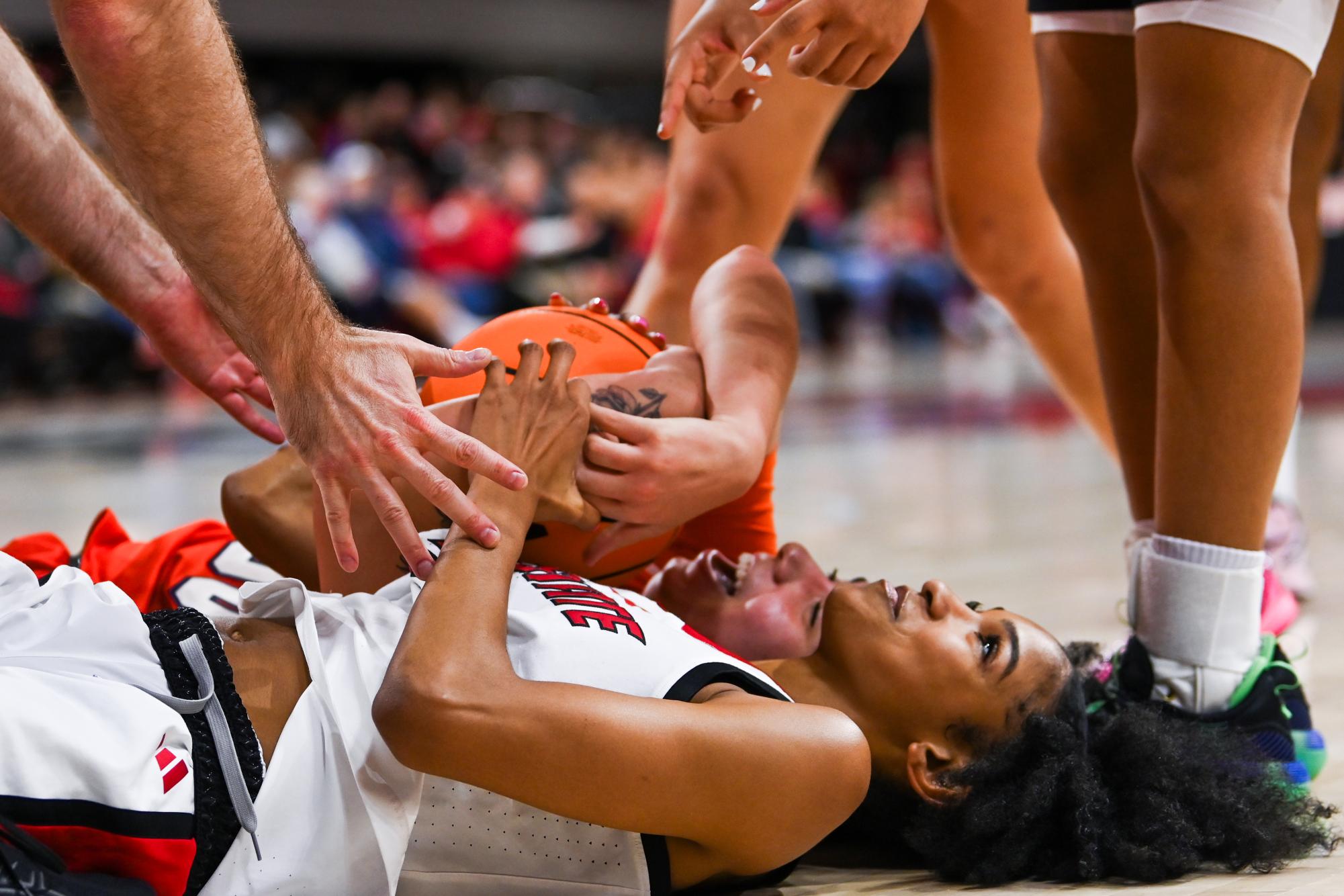 Junior guard Qadence Samuel lays on the ground after a scuffle during the game against Syracuse in Reynolds Coliseum on Sunday, Feb. 22, 2026. Samuels had three points and four rebounds. NC State beat Syracuse 82-69.