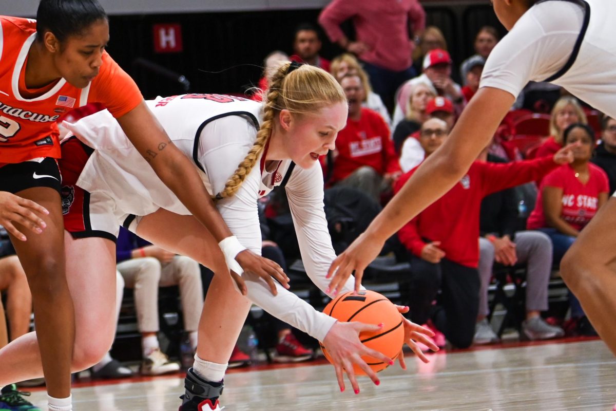 Sophomore forward Tilda Trygger dives for the ball during the game against Syracuse in Reynolds Coliseum on Sunday, Feb. 22, 2026. Trygger had 14 points, seven rebounds and two steals. NC State beat Syracuse 82-69.