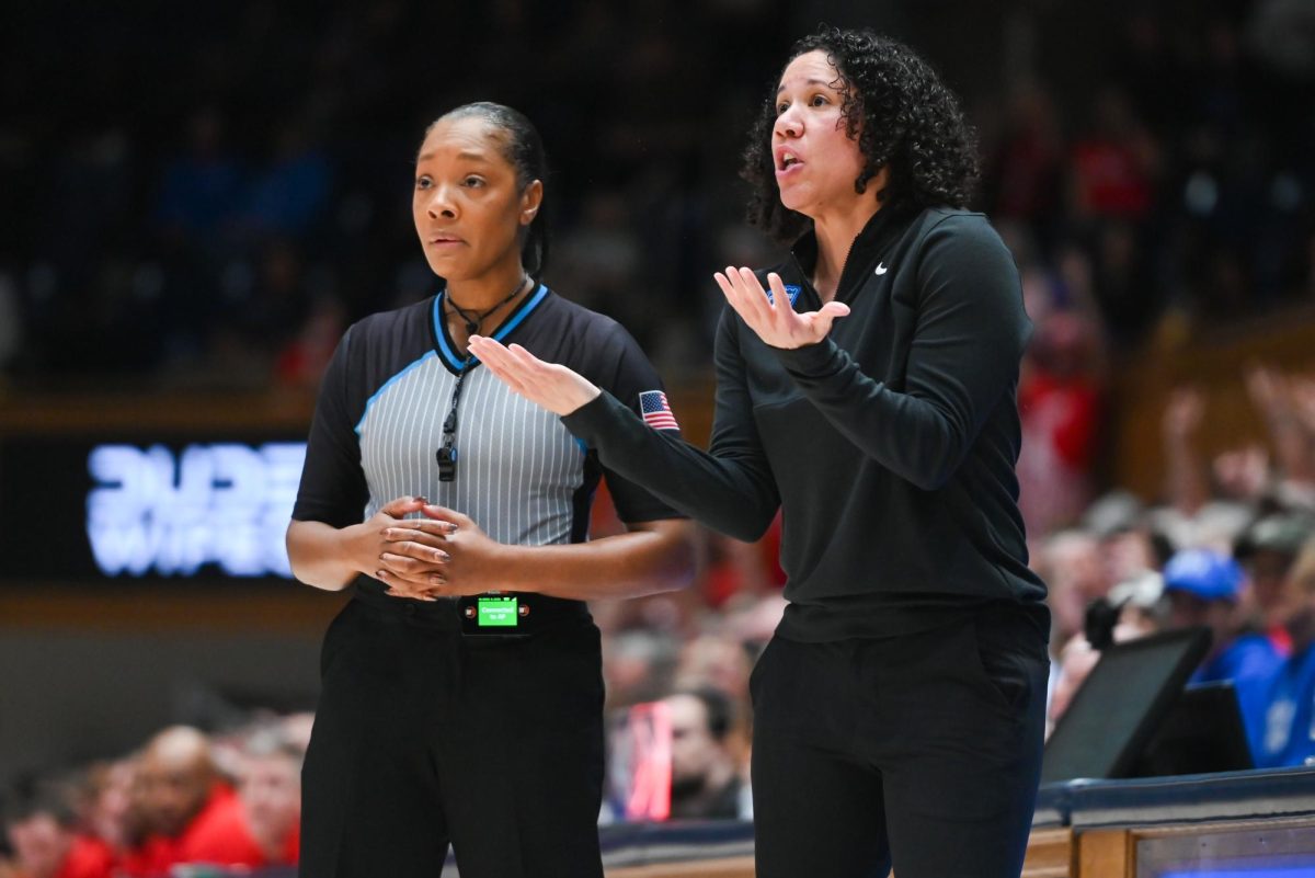 Duke head coach Kara Lawson talks to a referee during the game against Duke in Cameron Indoor Stadium on Thursday Feb 19, 2026. NC State lost to Duke 83-65.