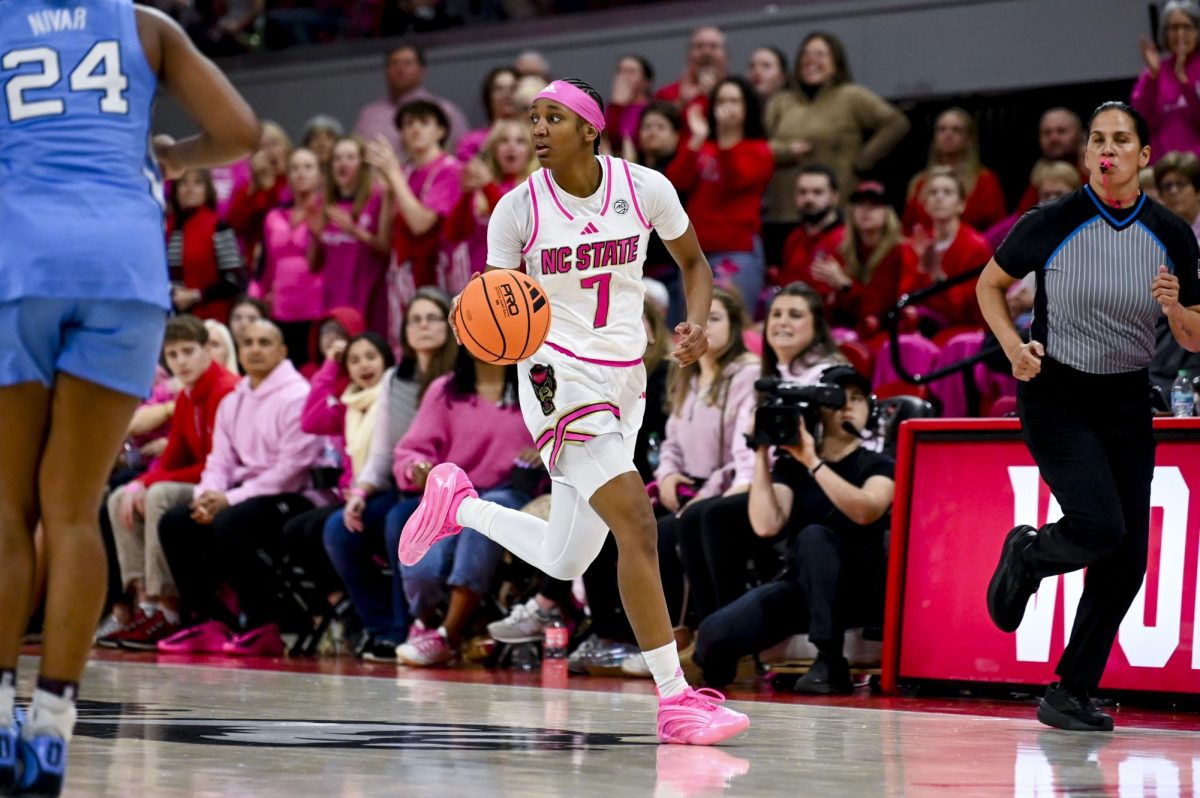 Freshman guard Destiny Lunan moves the ball down the court during the Play4Kay game against Chapel Hill at Reynolds Coliseum on Monday, Feb. 2, 2026. Lunan scored six points. The Tar Heels defeated the Wolfpack 61-59. 
