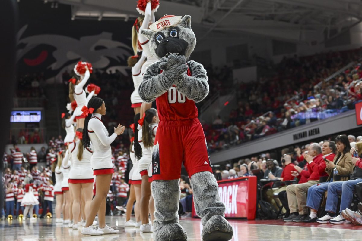 Mr. Wuf claps during a timeout in the game against Florida State at Reynolds Coliseum on Thursday, Feb. 5, 2026. The Wolfpack defeated the Seminoles 83-55.