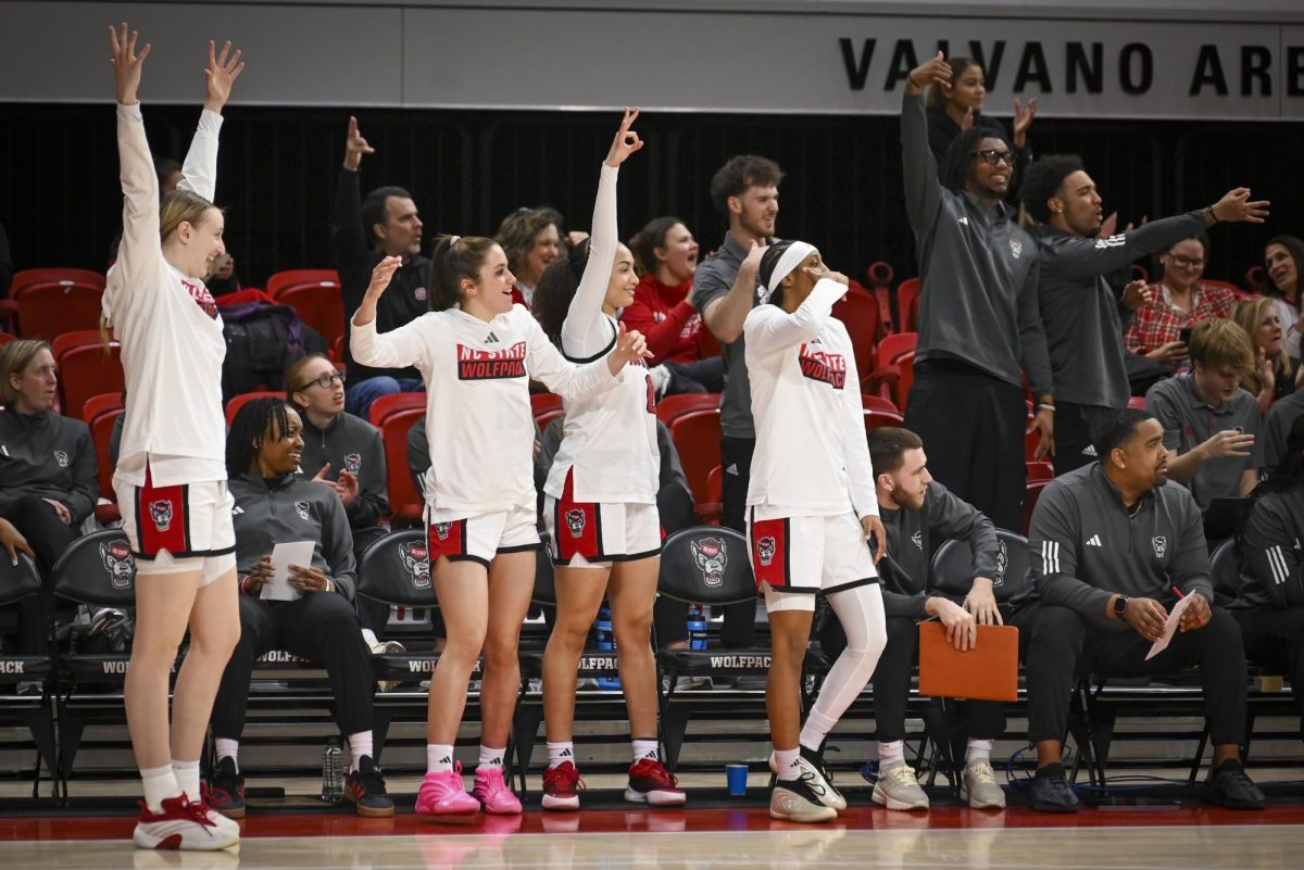 NC State players celebrate after a made basket during the game against Florida State at Reynolds Coliseum on Thursday, Feb. 5, 2026. The Wolfpack defeated the Seminoles 83-55.