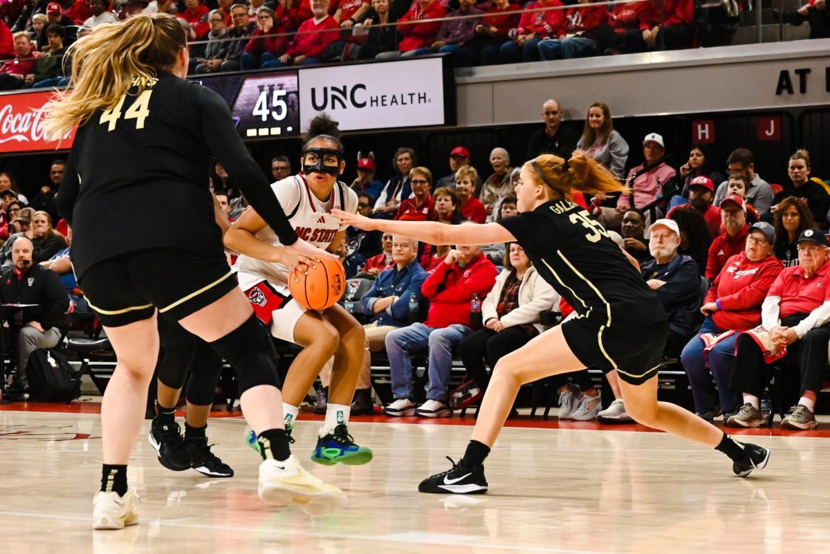 Sophomore guard Zamareya Jones works against defenders during the game against Wake Forest at Reynolds Coliseum on Thursday, Feb. 26, 2026. The Wolfpack defeated the Demon Deacons 65-56.