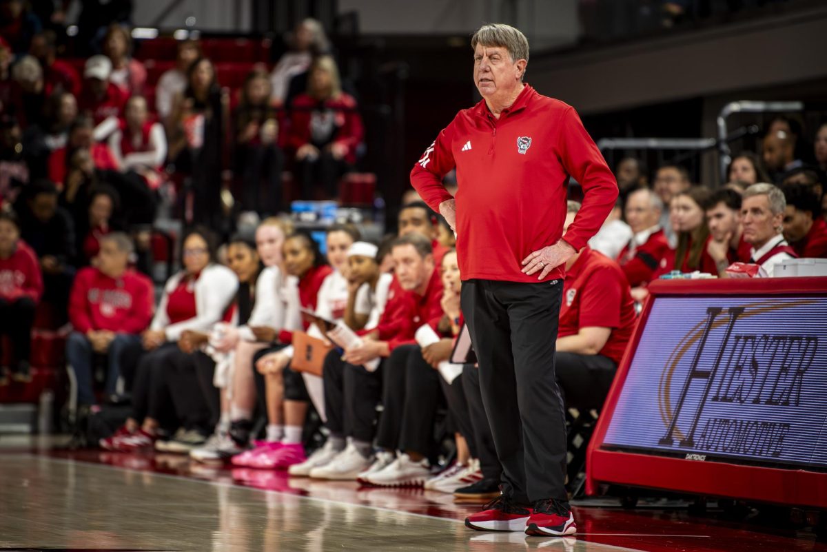 Head coach Wes Moore stands on the court during the game against Wake Forest in Reynolds Coliseum on Thursday, Feb. 26, 2026. The Wolfpack defeated the Demon Deacons 65-56.