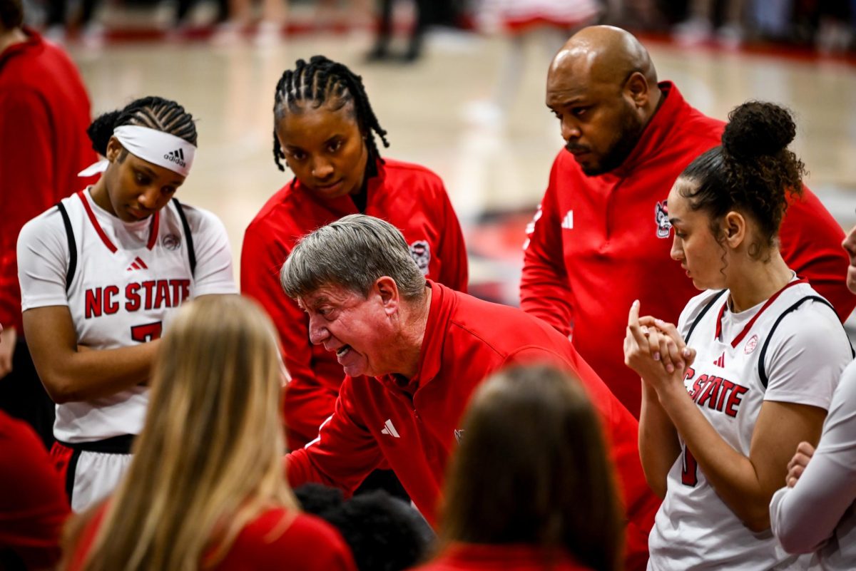 Head coach Wes Moore yells in the team huddle during the game against Wake Forest in Reynolds Coliseum on Thursday, Feb. 26, 2026. The Wolfpack defeated the Demon Deacons 65-56.