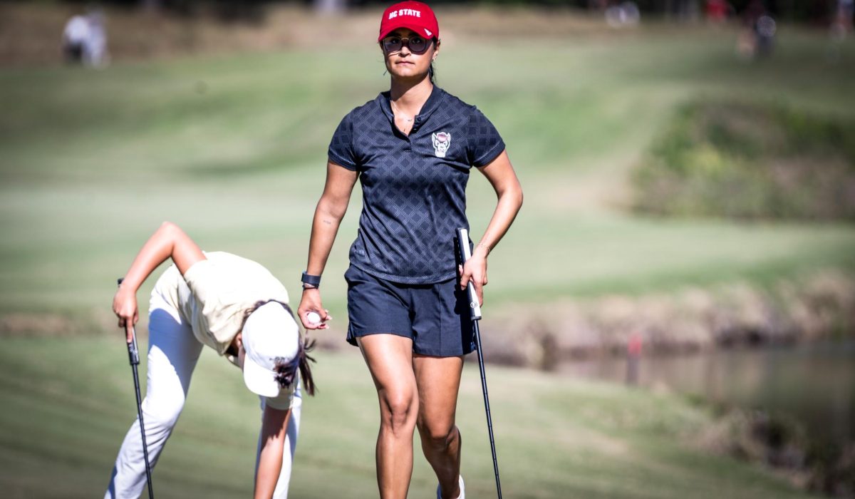 Senior Golfer Vania Simont walking off after sinking her putt at round 2 of the Ruth's Chris Tar Heel Invitational at the UNC Finley Golf Course on Saturday, Oct. 18, 2025.. NC State finished in third place at the Invitational.