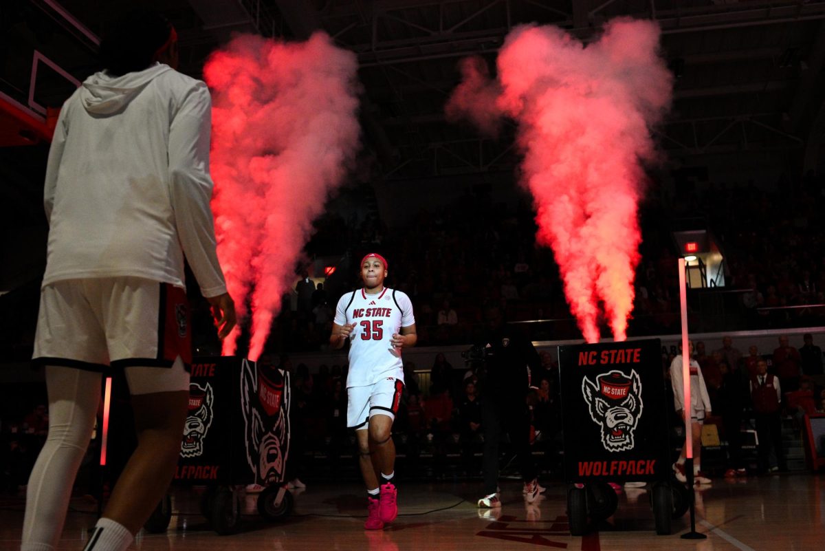 Junior guard Zoe Brooks runs out during starting lineup introductions before the game against Syracuse at Reynolds Coliseum on Sunday, Feb. 22, 2026.  Brooks scored 20 points. NC State beat Syracuse 82-69.