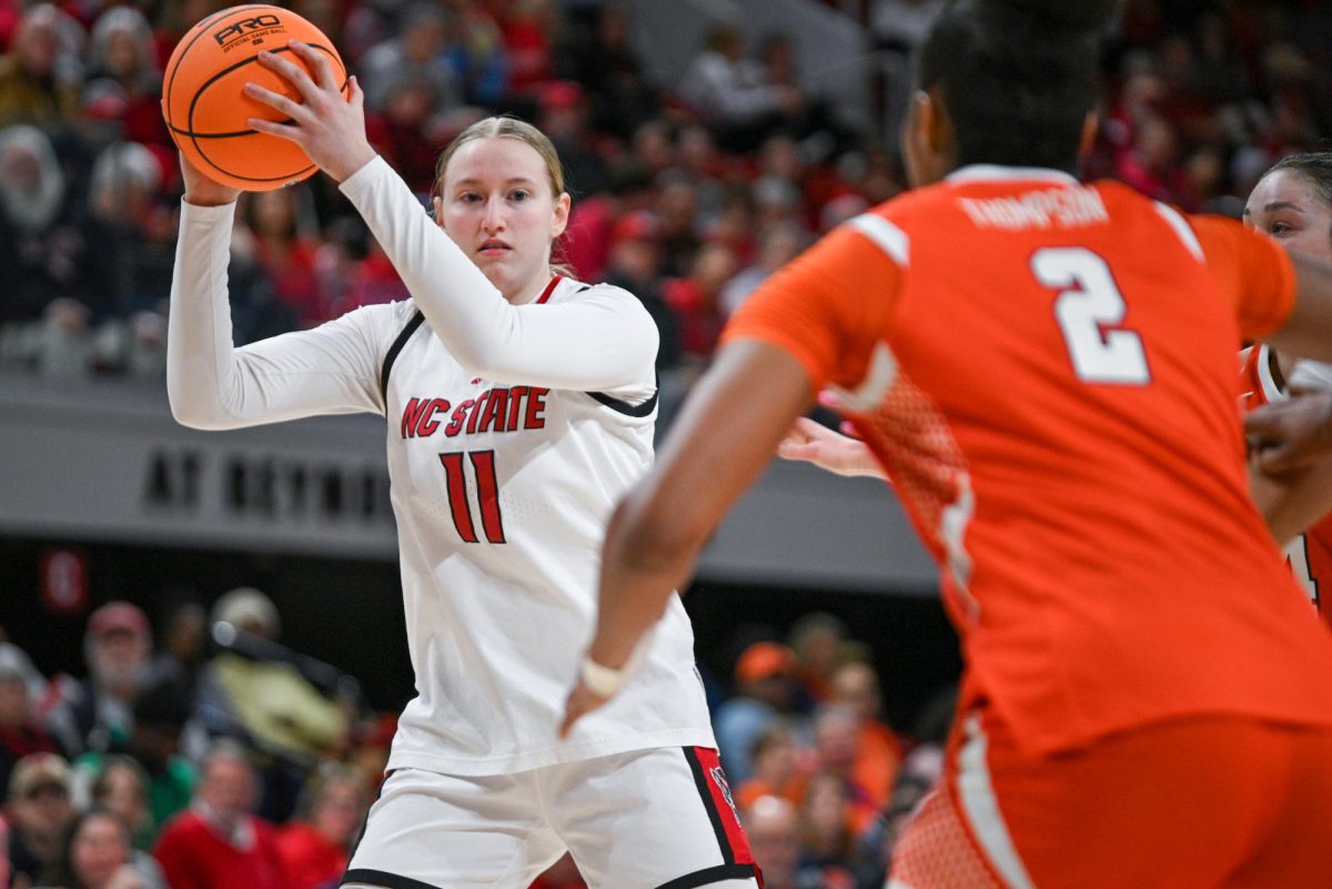 Junior forward Maddie Cox looks to make a pass during the game against Syracuse at Reynolds Coliseum on Sunday, Feb. 22, 2026. Cox scored two points. NC State beat Syracuse 82-69.