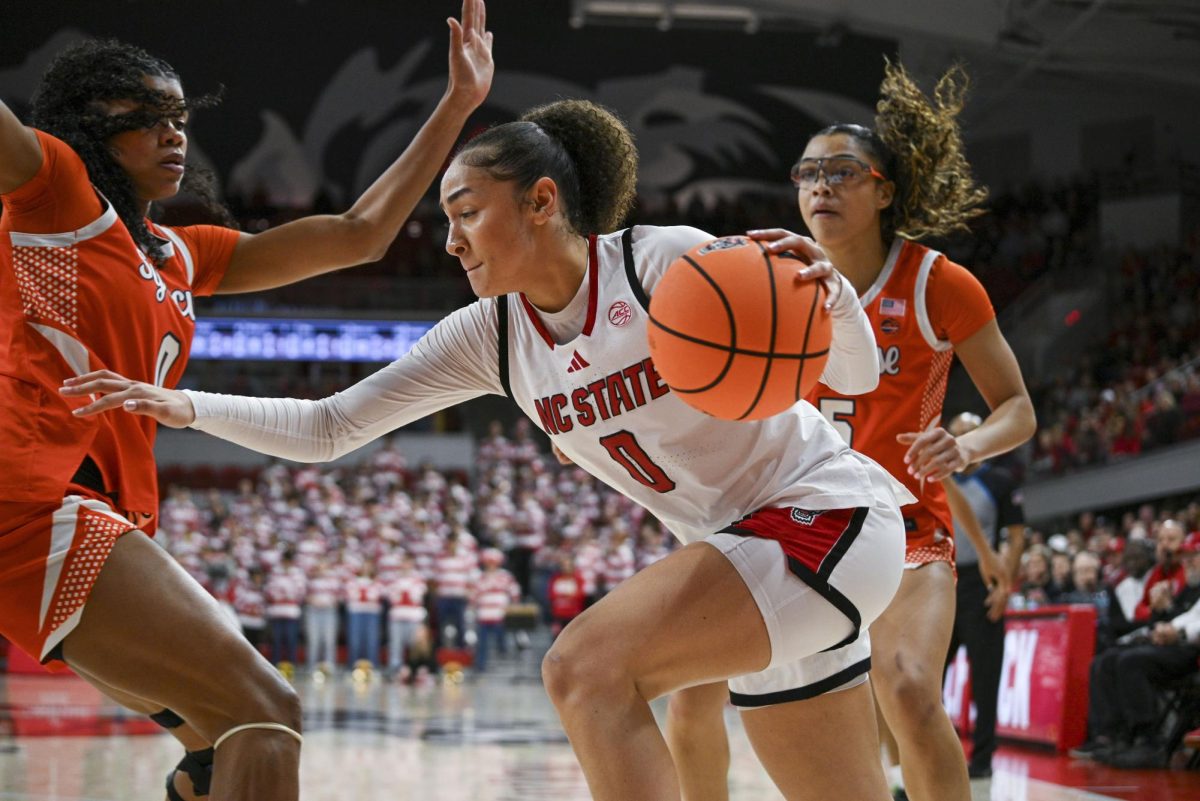 Sophomore guard Devyn Quigley drives to the basket during the game against Syracuse at Reynolds Coliseum on Sunday, Feb. 22, 2026. NC State beat Syracuse 82-69.