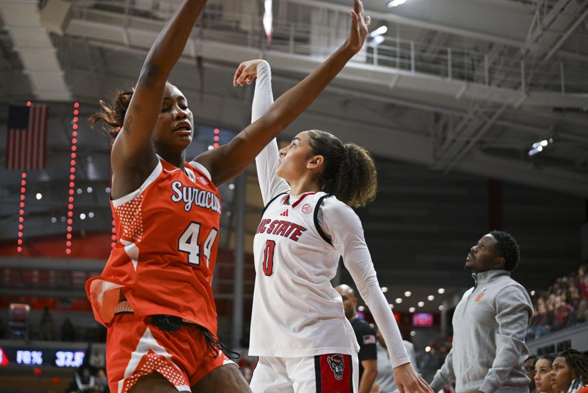 Sophomore guard Devyn Quigley shoots the ball during the game against Syracuse at Reynolds Coliseum on Sunday, Feb. 22, 2026. NC State beat Syracuse 82-69.