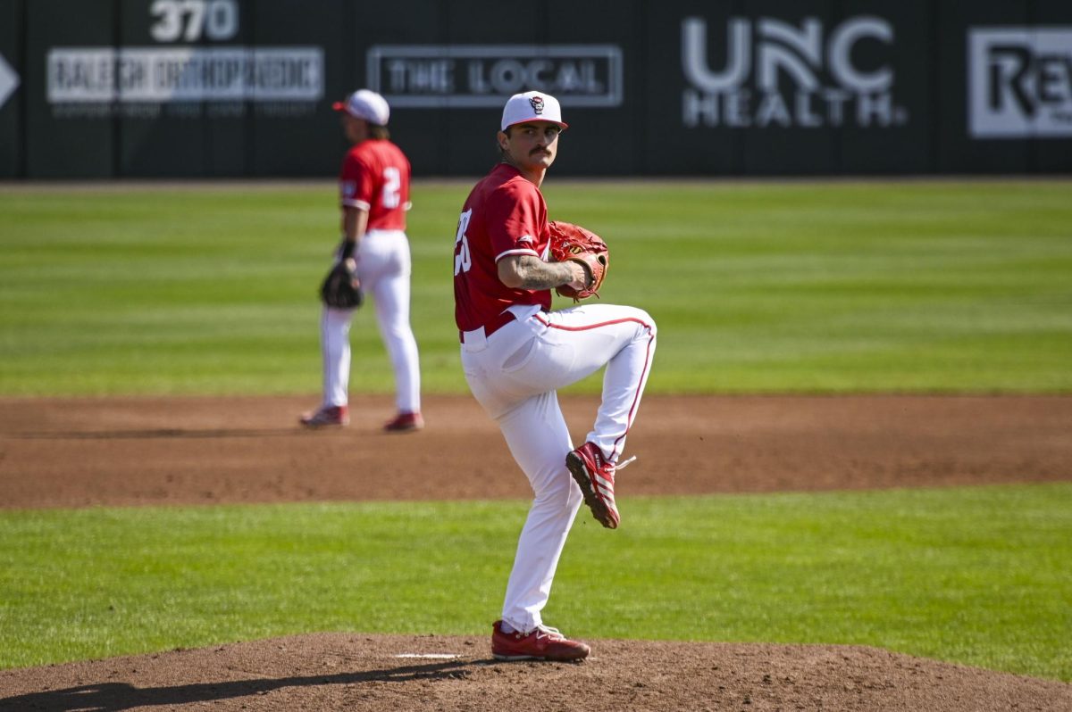 Junior pitcher Cooper Consiglio winds up the pitch during the game against Sacred Heart in Doak Field in Dail Park on Sunday, March 1, 2026. The Wolfpack defeated the Pioneers 13-0.