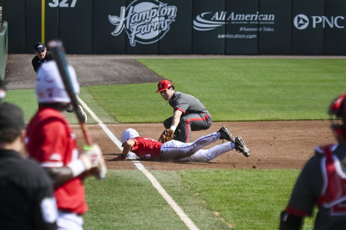 Sophomore outfielder Ty Head dives back into third to evade the tag during the game against Sacred Heart in Doak Field in Dail Park on Sunday, March 1, 2026. The Wolfpack defeated the Pioneers 13-0.