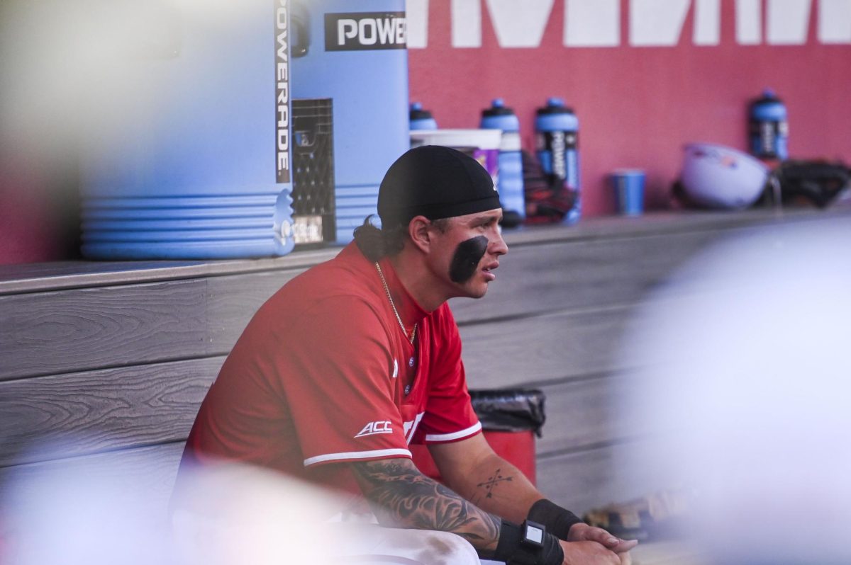Sophomore outfielder Ty Head rests in the dugout during the game against Sacred Heart in Doak Field in Dail Park on Sunday, March 1, 2026. The Wolfpack defeated the Pioneers 13-0.