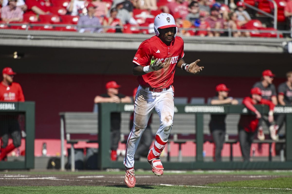 Junior outfielder Sherman Johnson celebrates a hit during the game against Sacred Heart in Doak Field in Dail Park on Sunday, March 1, 2026. The Wolfpack defeated the Pioneers 13-0.